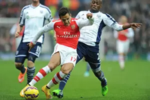 West Bromwich Albion V Arsenal 2014/15 Prints: Arsenal's Alexis Sanchez Outmaneuvers West Brom's Youssouf Mulumbu