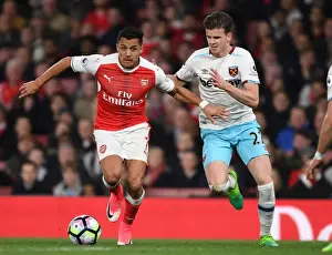 Arsenal V West Ham United 2016-17 Prints: Arsenal's Alexis Sanchez Outmaneuvers West Ham's Sam Byram