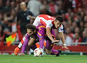 Arsenal V Galatasaray 2014/15 Champions League Prints: Arsenal's Alexis Sanchez Stumbles Against Galatasaray's Hamit Altintop - UEFA Champions League 2014