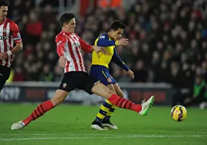 Southampton V Arsenal 2014-15 Prints: Arsenal's Alexis Sanchez Tripped by Southampton's Florin Gardos during Premier League Clash
