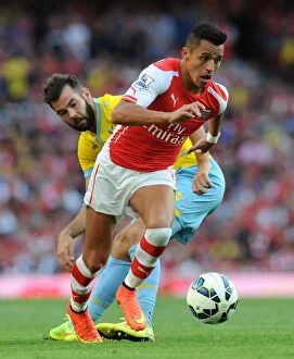 Images Dated 16th August 2014: Arsenal's Alexis Sanchez vs. Crystal Palace's Joe Ledley: A Premier League Battle