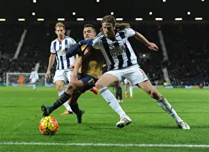 West Bromwich Albion V Arsenal 2015-16 Prints: Arsenal's Alexis Sanchez vs. West Brom's Jonas Olsson: A Battle at The Hawthorns