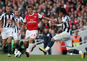 Arsenal V West Bromwich Albion 2010-11 Prints: Arsenal's Andrey Arshavin Faces Off Against Gonzalo Jara of West Bromwich Albion in Intense Barclays Premier League