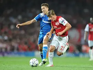 Arsenal V Olympiacos 2011-12 Prints: Arsenal's Andrey Arshavin Fouled by Olympiacos David Fuster in 2011 Champions League Clash