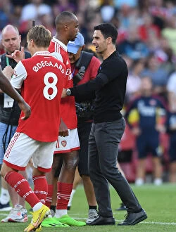 Arsenal v Fulham 2022-23 Collection: Arsenal's Arteta Celebrates with Magalhaes after Arsenal's Victory over Fulham (2022-23)