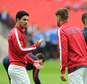 Arsenal V Wigan Athletic - FA Cup Semi Final 2014 Prints: Arsenal's Arteta and Ramsey Discuss Strategy Before FA Cup Semi-Final vs