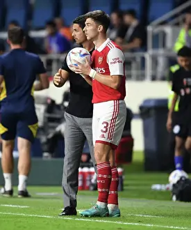 Arsenal's Arteta and Tierney in Action Against AC Milan at the Dubai Super Cup, 2022