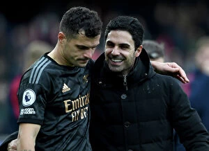 Images Dated 12th March 2023: Arsenal's Arteta and Xhaka Celebrate Fulham Victory in Premier League 2022-23