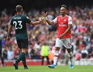 Arsenal's Aubameyang Celebrates with Burnley's Pieters after Intense Arsenal v Burnley Clash (2019-20)