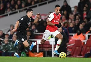 Images Dated 6th December 2019: Arsenal's Aubameyang Clashes with Brighton's Alzate in Premier League Showdown