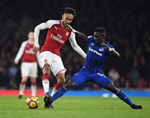 Arsenal v Everton 2017-18 Collection: Arsenal's Aubameyang Clashes with Everton's Gueye in Premier League Showdown