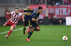 Images Dated 20th February 2020: Arsenal's Aubameyang Clashes with Olympiacos Valbuena in Europa League Showdown