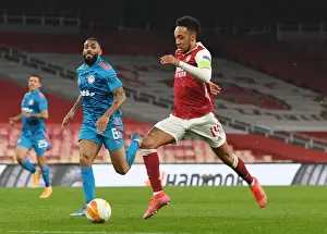 Arsenal's Aubameyang in Europa League Action: Emirates Stadium Showdown vs. Olympiacos Amidst Empty Seats (2020-21)