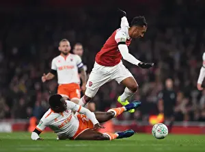 Arsenal V Blackpool Carabao Cup 2018-19 Prints: Arsenal's Aubameyang Faces Off Against Blackpool's Bola in Carabao Cup Clash
