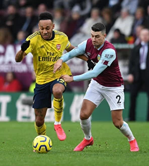 Burnley v Arsenal 2019-20 Collection: Arsenal's Aubameyang Faces Off Against Burnley's Lowton in Premier League Clash
