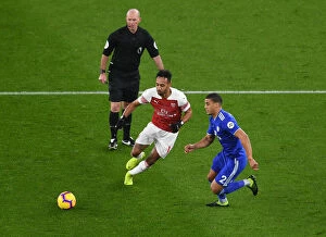Images Dated 29th January 2019: Arsenal's Aubameyang Faces Off Against Cardiff's Peltier in Premier League Clash