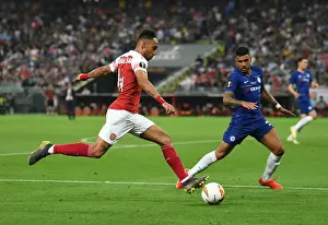 Arsenal V Chelsea Europa League Cup Final 2019 Prints: Arsenal's Aubameyang Faces Off Against Chelsea's Emerson in Europa League Final Showdown