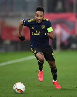 Olympiacos v Arsenal 2019-20 Collection: Arsenal's Aubameyang Faces Off Against Olympiacos in Europa League Clash