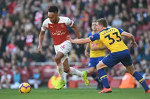 Arsenal V Southampton 2018-19 Prints: Arsenal's Aubameyang Faces Off Against Southampton's Targett in Premier League Clash