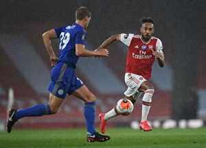 Arsenal v Leicester City 2019-20 Collection: Arsenal's Aubameyang Goes Head-to-Head with Leicester City in Premier League Clash