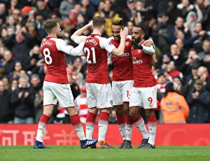 Arsenal's Aubameyang, Lacazette, Chambers, and Ramsey Celebrate Goals Against Stoke City