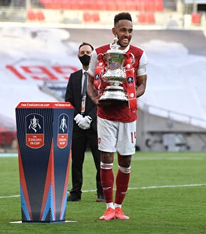 Images Dated 2nd August 2020: Arsenal's Aubameyang Lifts Empty FA Cup: Arsenal's Historic Victory Over Chelsea in Empty Wembley