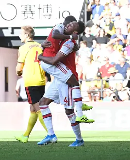 Arsenal's Aubameyang and Maitland-Niles: Celebrating a Victory Over Watford (2019-20)