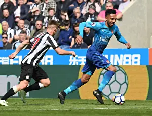 Arsenal's Aubameyang Outmaneuvers Newcastle's Ritchie in Premier League Clash