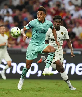 Arsenal's Aubameyang Outmaneuvers PSG's Mbe Soh in International Champions Cup Clash