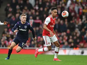 Arsenal V West Ham United 2019-20 Prints: Arsenal's Aubameyang Outmaneuvers West Ham's Bowen in Premier League Clash