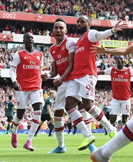 Arsenal v Burnley 2019-20 Collection: Arsenal's Aubameyang, Pepe, and Lacazette Celebrate Goals Against Burnley (2019-20)