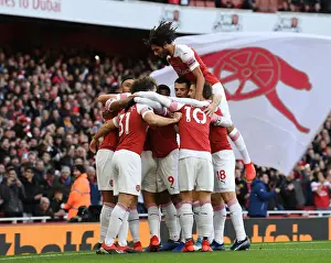 Arsenal V Burnley 2018-19 Prints: Arsenal's Aubameyang Scores and Celebrates with Team against Burnley (2018-19)