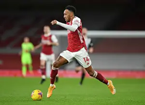 Arsenal V Newcastle United 2020-21 Prints: Arsenal's Aubameyang Shines Alone: A Lone Star Performance at Empty Emirates Against Newcastle (2020-21)