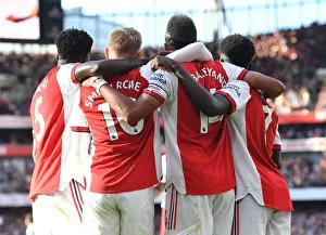 Arsenal's Aubameyang, Smith Rowe, and Saka Celebrate Goals Against Tottenham in 2021-22 Premier League