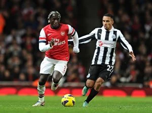 Arsenal v Newcastle United 2012-13 Collection: Arsenal's Bacary Sagna Clashes with Newcastle's James Tavernier in Premier League Showdown