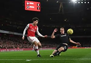 Arsenal's Bellerin Faces Off Against Burn in Intense Premier League Clash
