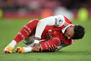 Arsenal's Ben White Clutches Injured Ankle Amidst Intense Arsenal v Chelsea Rivalry (2022-23)