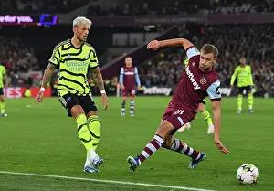 Arsenal's Ben White Faces Pressure from West Ham's Tomas Soucek in Carabao Cup Clash