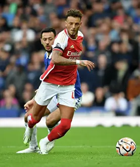 Arsenal's Ben White Fends Off Everton's Dwight McNeil in Premier League Clash (2023-24)