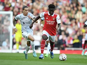 Arsenal's Ben White Outmaneuvers Liverpool's Tsimikas in Premier League Showdown (2022-23)