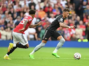 Arsenal's Ben White Outsmarts Jadon Sancho: A Premier League Victory for the Gunners (2022-23)