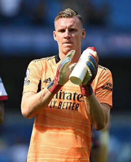 Manchester City v Arsenal 2021-22 Collection: Arsenal's Bernd Leno Applauding Fans in Manchester City Showdown - Premier League 2021-22