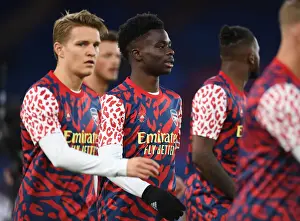 Arsenal's Bid for Victory: Saka Warms Up Ahead of Crystal Palace Clash (Premier League, April 2022)