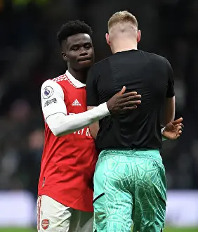Arsenal's Bukayo Saka and Aaron Ramsdale Celebrate Victory over Tottenham Hotspur in 2022-23 Premier League Clash