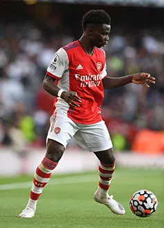 Arsenal V Tottenham Hotspur 2021-22 Prints: Arsenal's Bukayo Saka in Action: Arsenal vs