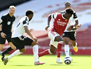 Images Dated 18th April 2021: Arsenal's Bukayo Saka in Action against Fulham during Empty Emirates Stadium, Premier League 2020-21