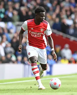 Arsenal's Bukayo Saka in Action: Premier League Clash Against Brighton & Hove Albion, 2021-22