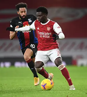 Arsenal's Bukayo Saka in Action: Premier League Showdown at Empty Emirates Against Crystal Palace, 2021