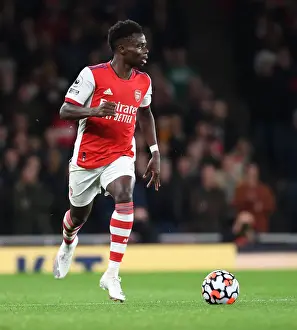 Arsenal's Bukayo Saka in Action: Premier League Showdown vs. Aston Villa, 2021-22