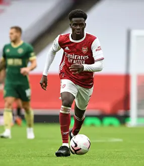 Arsenal's Bukayo Saka in Action Against Sheffield United in Empty Emirates Stadium (2020-21)